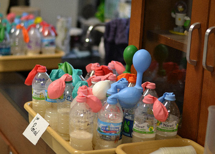Balloons filling with CO2 produced by yeast.