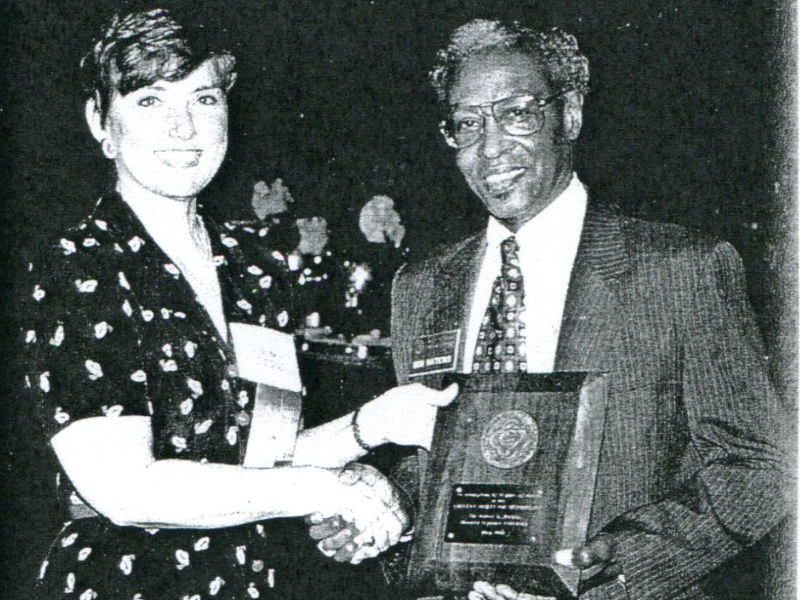 Robert D. Watkins shakes hands with former ASM President Carol Nacy.